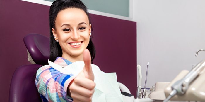 happy woman at dental clinic
