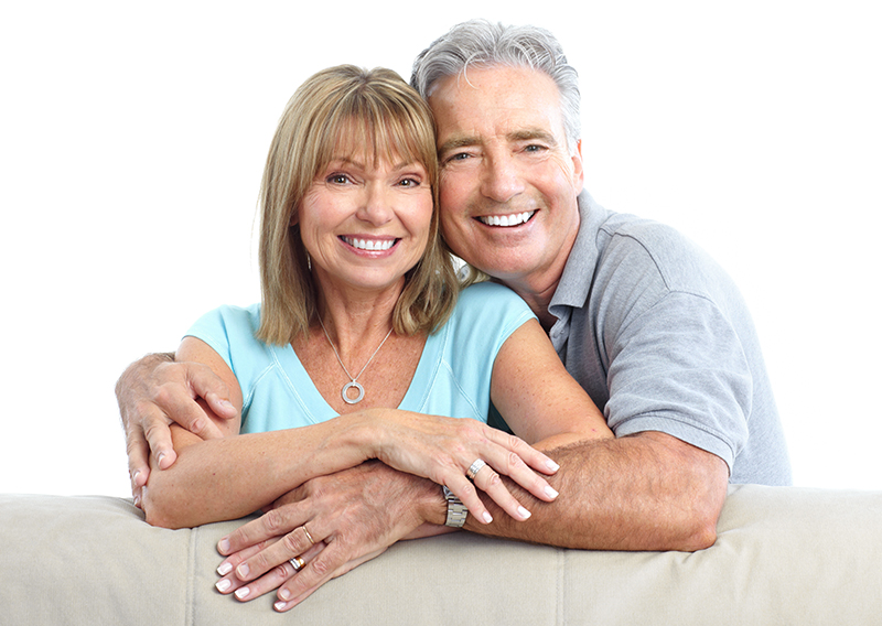 Senior Happy Couple With Dental Implants From Dental Care of Northfield